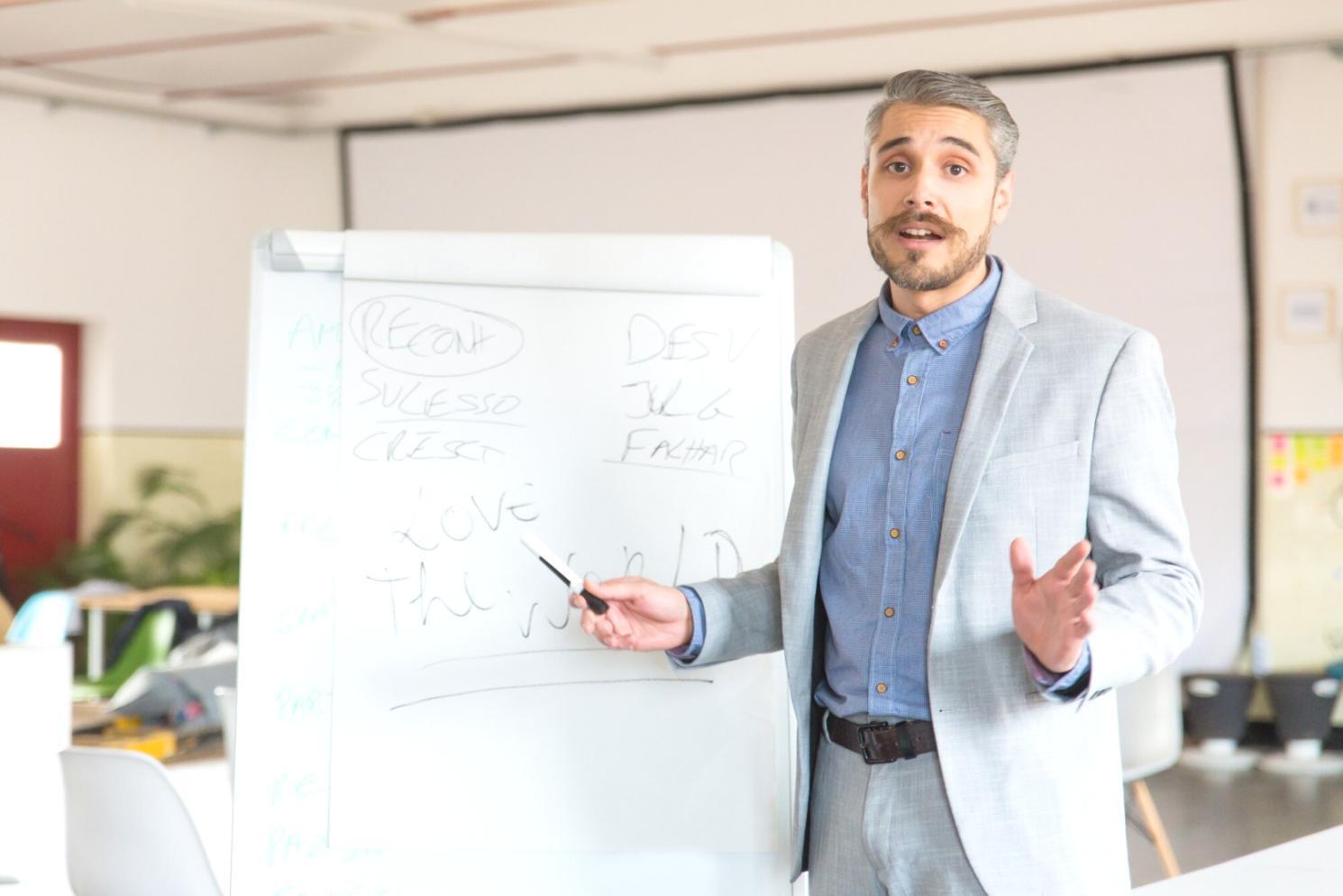 Financial analysis training session with investment professionals reviewing market data
